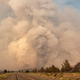 A huge ash plume rises into the sky as the Lava fire explodes in Weed, California on July 1, 2021.